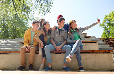 Image showing happy teenage students taking selfie by smartphone