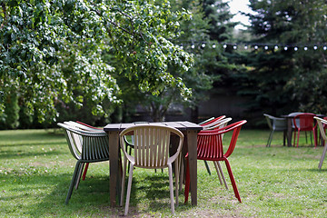 Image showing table with chairs at summer garden