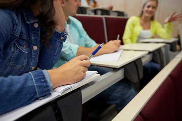 Image showing group of students with notebooks at lecture hall