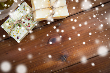 Image showing handmade soap bars on wood