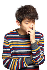 Image showing  young thoughtful man isolated over white background