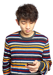 Image showing Young man using mobile phone texting