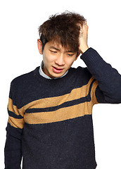 Image showing Closeup portrait, stressed young asian man, hands on head with b