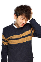 Image showing Closeup portrait, stressed young asian man, hands on head with b