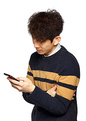 Image showing young asia man texting on mobilephone