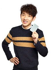 Image showing Asian young man holding card