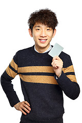 Image showing Asian young man holding card