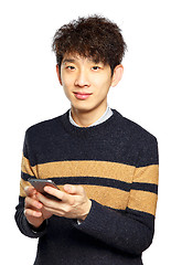 Image showing Young man using mobile phone on white background