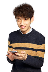 Image showing Young man using mobile phone on white background