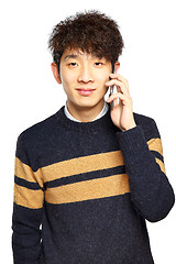 Image showing Happy young man talking on mobilephone