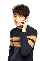 Image showing Happy young man talking on mobilephone