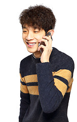 Image showing Happy young man talking on mobilephone