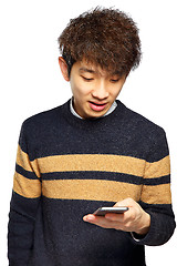 Image showing Young man using mobile phone on white background