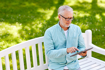 Image showing senior man with tablet pc at summer park