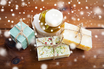 Image showing handmade soap bars on wood