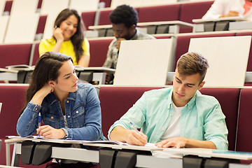 Image showing group of students with notebooks in lecture hall