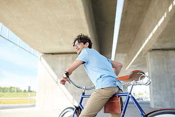 Image showing young hipster man riding fixed gear bike