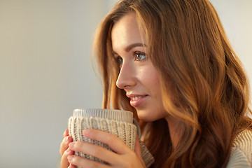 Image showing close up of happy woman with tea or coffee cup