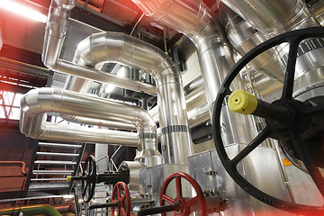 Image showing Equipment, cables and piping in red tones