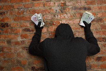 Image showing Burglar with money in hand