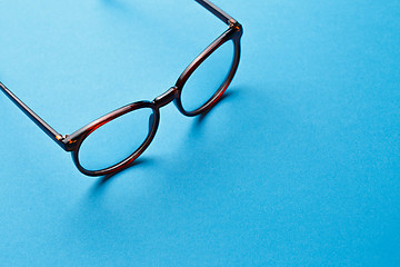 Image showing Brown spectacles on blue background