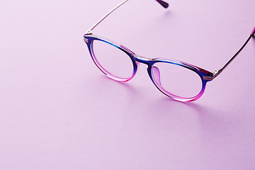 Image showing Eyeglasses in empty purple background