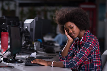 Image showing a young African American woman feels tired in the modern office