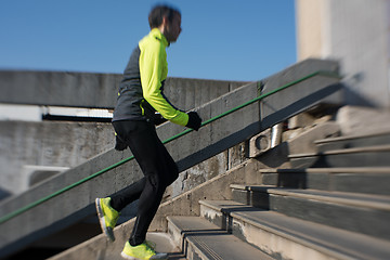 Image showing man jogging on steps