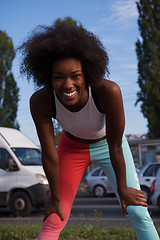 Image showing Portrait of sporty young african american woman running outdoors