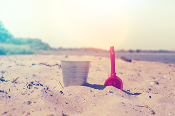 Image showing Bucket and showel at a beach