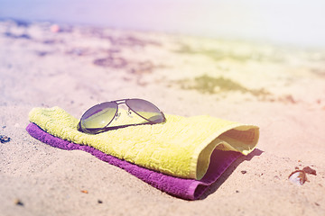 Image showing Beach towels with sunglasses