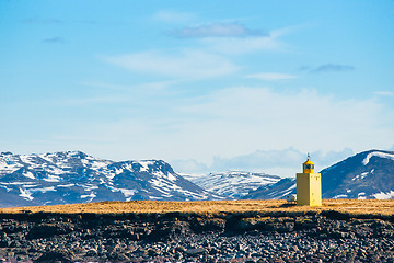 Image showing Lighthouse in a landscape with mountains