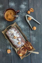 Image showing Homemade chocolate cake, cup of coffee and walnuts.