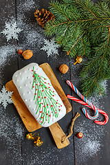 Image showing Christmas cake, candy, tree branches and nuts.