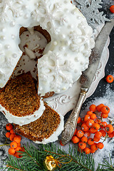 Image showing Christmas coffee cake with walnuts on a plate close-up.