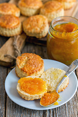 Image showing Homemade buns with orange jam.