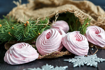 Image showing Homemade marshmallows berries and spruce branches.