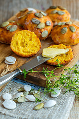 Image showing Homemade pumpkin scones with butter for breakfast.