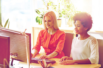 Image showing happy women or students with computer in office