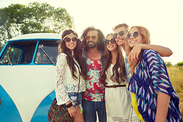 Image showing smiling young hippie friends over minivan car