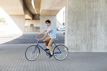 Image showing young hipster man riding fixed gear bike