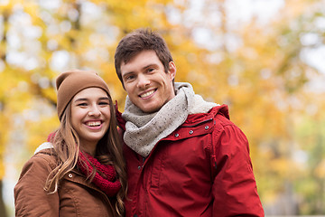 Image showing happy young couple walking in autumn park