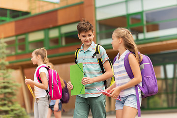 Image showing group of happy elementary school students walking