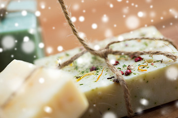 Image showing close up of handmade soap bars on wood