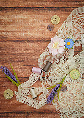 Image showing Lace and thread on wooden background