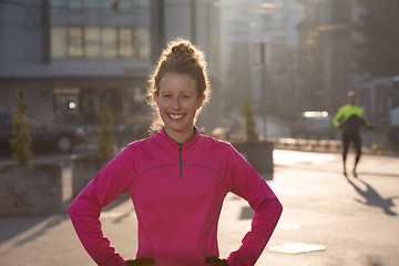 Image showing woman  stretching before morning jogging