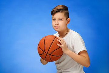 Image showing Adorable 11 year old boy child with basketball ball