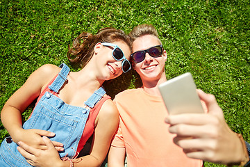 Image showing happy couple taking selfie on smartphone at summer