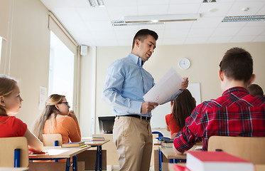 Image showing group of students and teacher with test results