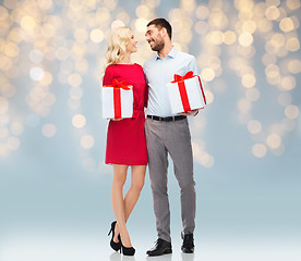 Image showing happy couple with gift boxes